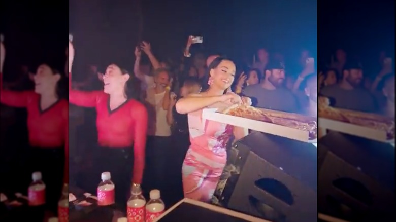 Katy Perry with pizza in club