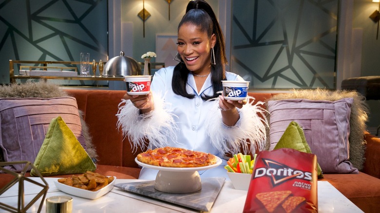 Keke Palmer holding Doritos Dips