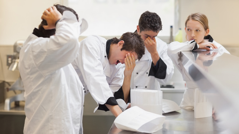 stressed and tired young chefs 