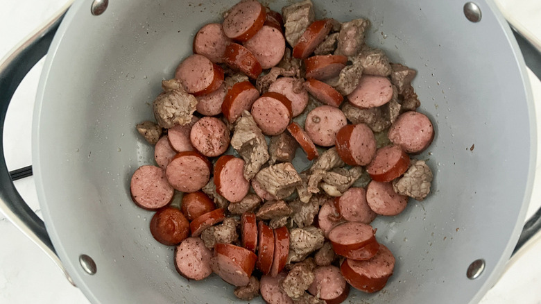 beef and sausage in pot