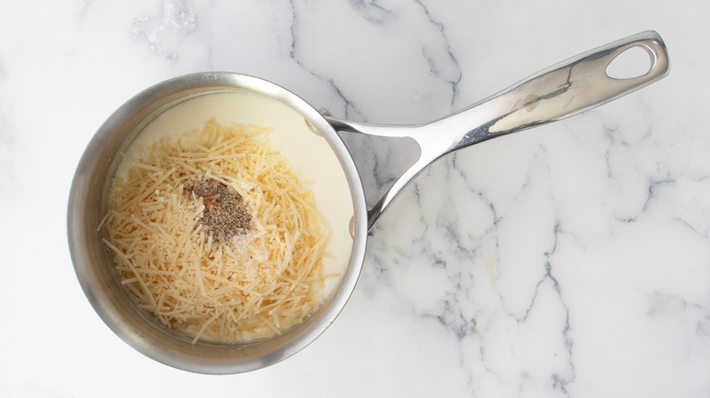 Parmesan and seasonings in saucepan