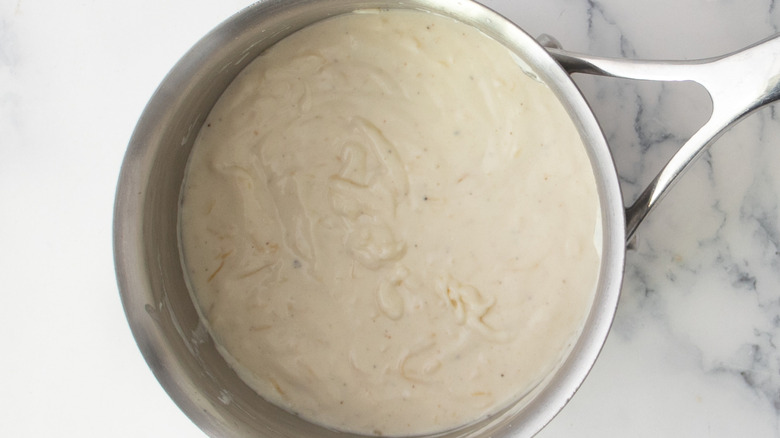 Mornay cheese sauce in saucepan