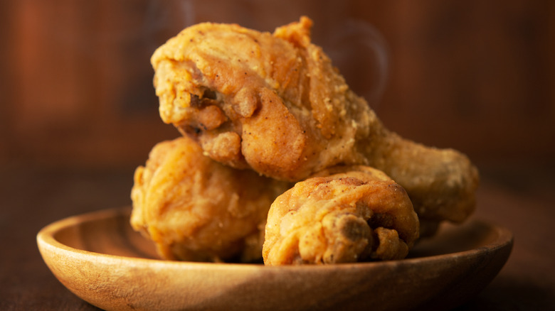 fried chicken on a wooden plate