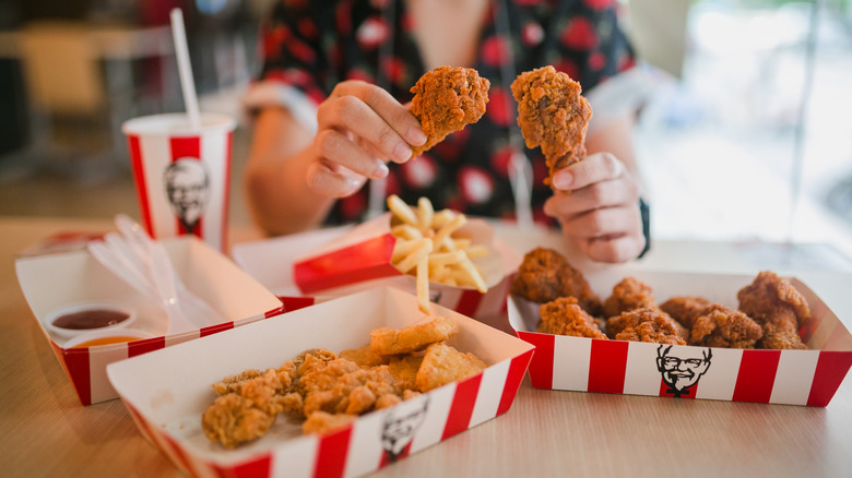 Woman holding KFC chicken