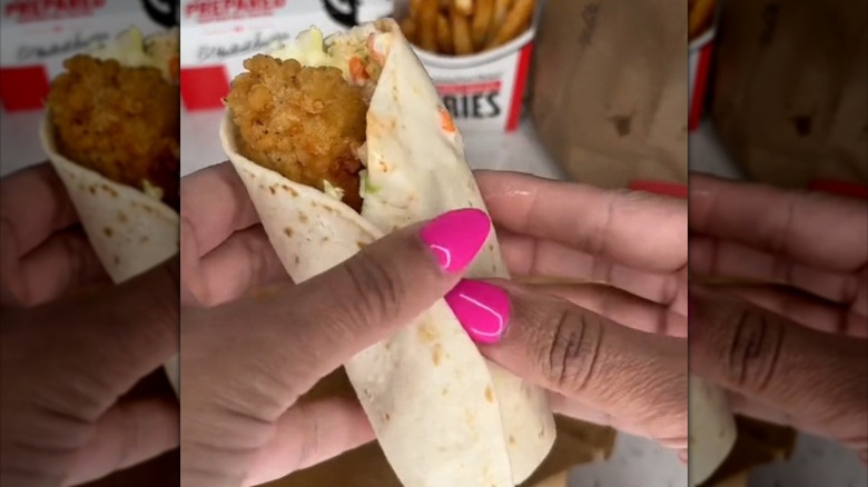 Person holding KFC wrap