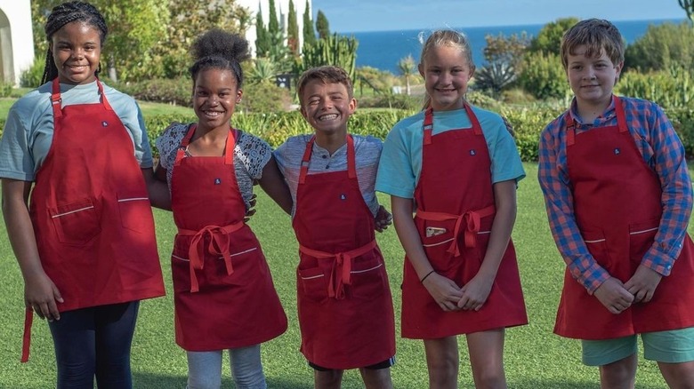 Kids Baking Competition contestants posing outside