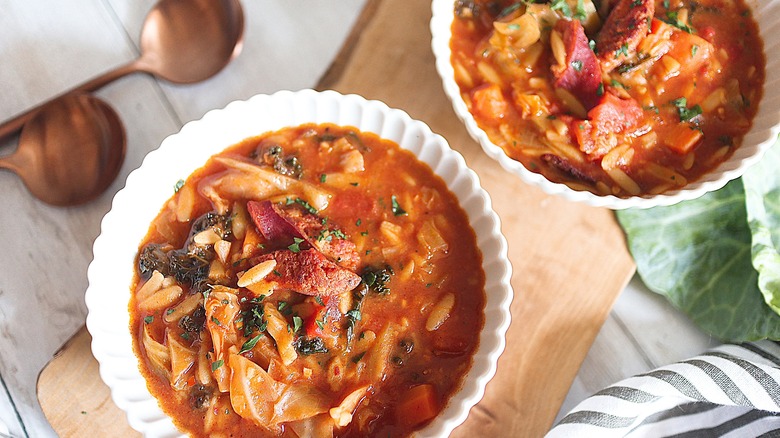 kielbasa stew in white bowl