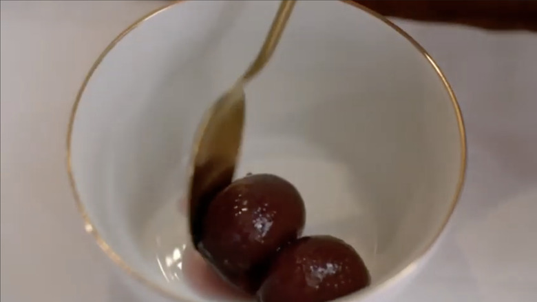 Two plums in a bowl