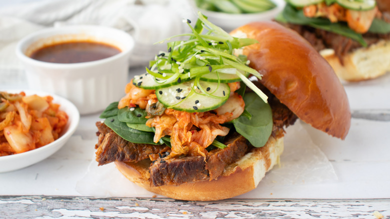 korean bulgogi bbq brisket sandwich with garnishes