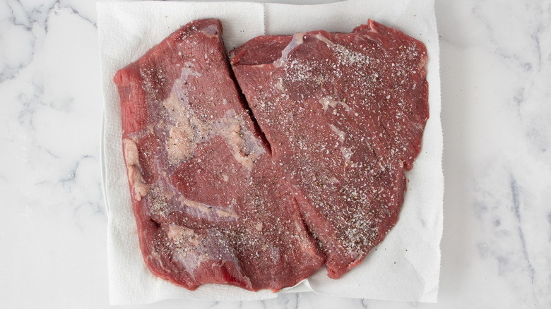 cut of brisket meat seasoned with salt and pepper