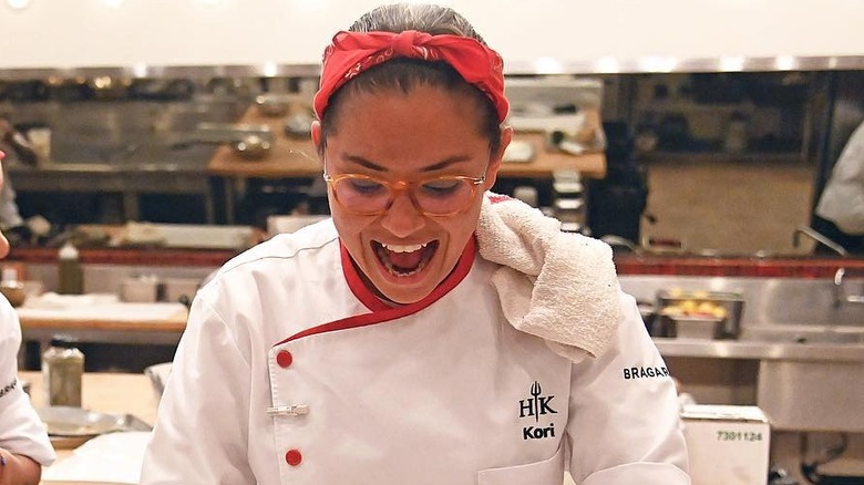 Kori Sutton cooking in a large kitchen