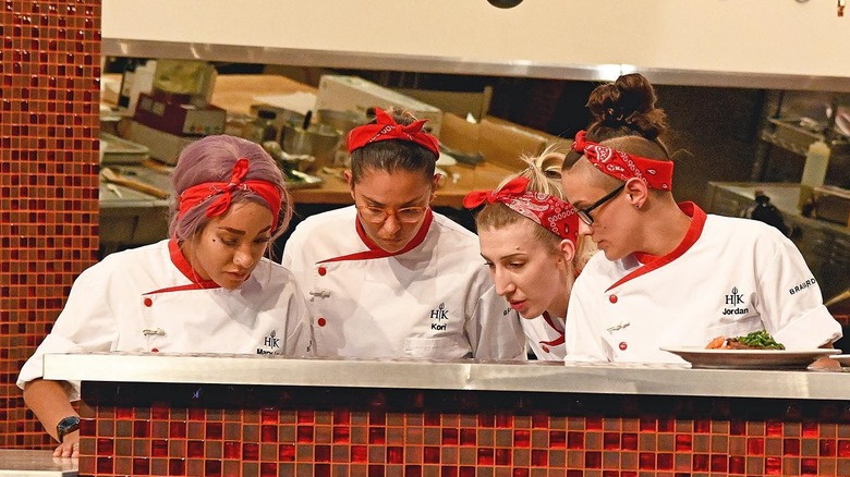 chefs looking at a dish