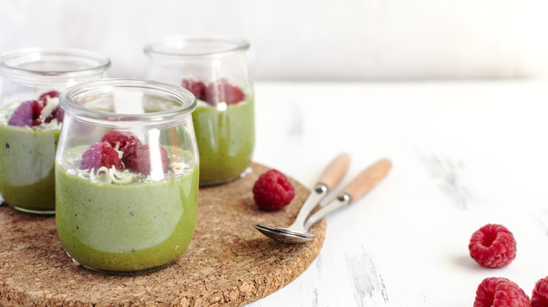 Avocado pudding topped with raspberries
