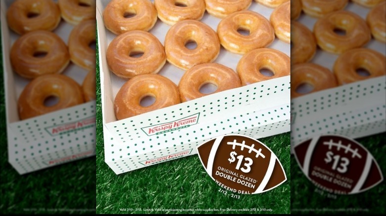 Box of Krispy Kreme glazed doughnuts with a promo football