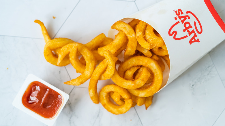 Arby's curly fries on a white background