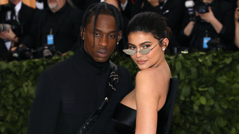 Travis Scott and Kylie Jenner at a fashion show together in 2018