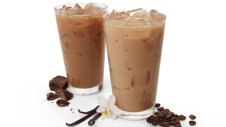 Taco John's cold brew in tall glasses with chocolate pieces and vanilla pods