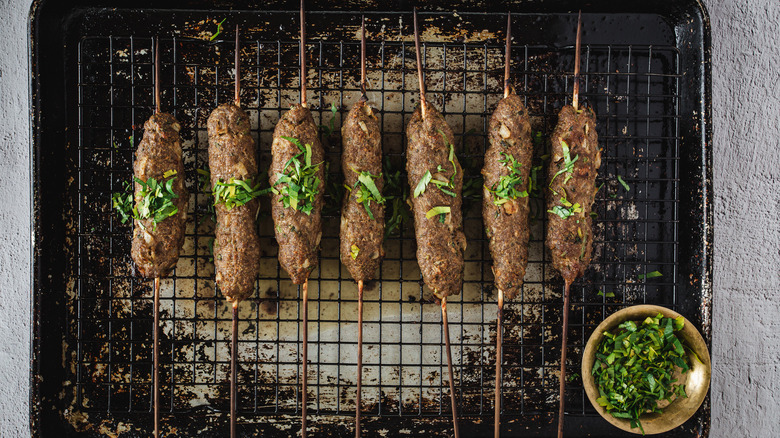 lamb kofta kebab skewers on baking dish