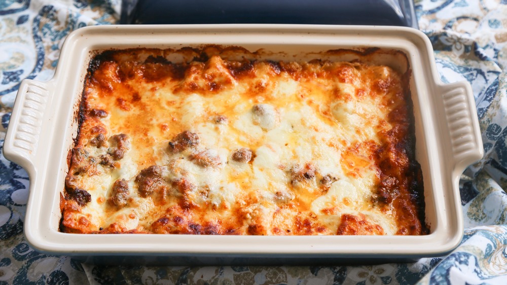 cooked lasagna in enamel dish