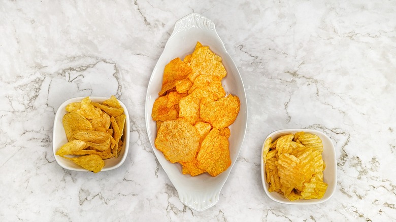 three bowls of lay's potato chips