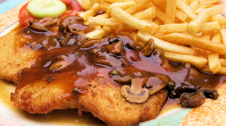 jägerschnitzel with fries on plate