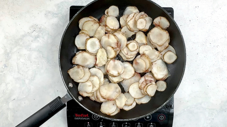 sunchokes frying in pan