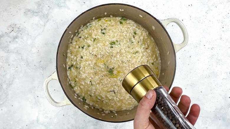 seasoning risotto with pepper