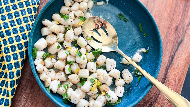 scallops in bowl with spoon