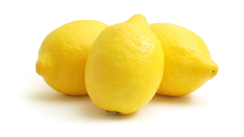 Three lemon on white background