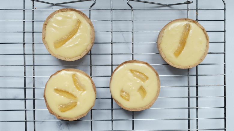 lemon tarts on cooling rack