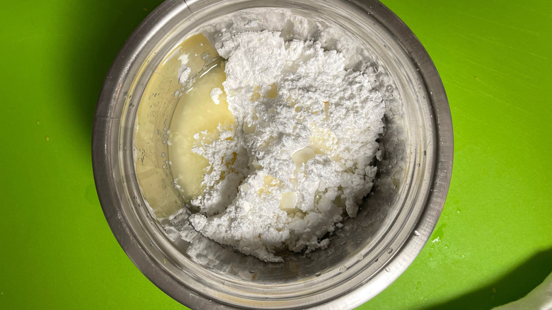 Powdered sugar and lemon juice in bowl