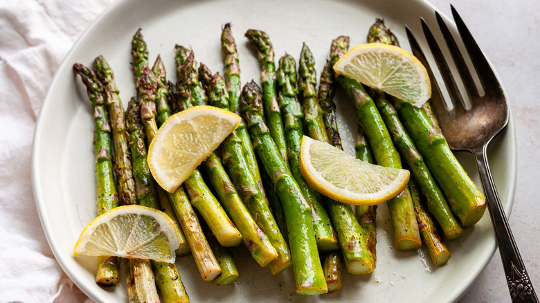 asparagus and lemon on plate 