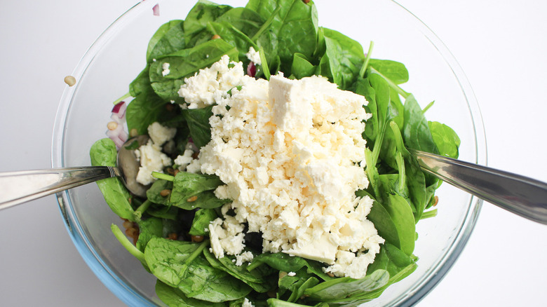 topping salad with feta cheese