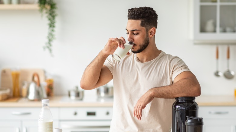 Man drinking glass of milk