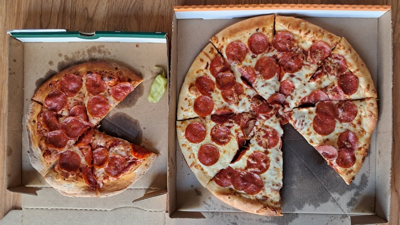 Pepperoni pizzas in boxes