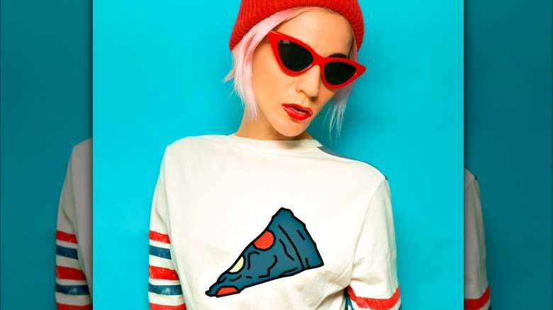 blond woman wearing pizza shirt