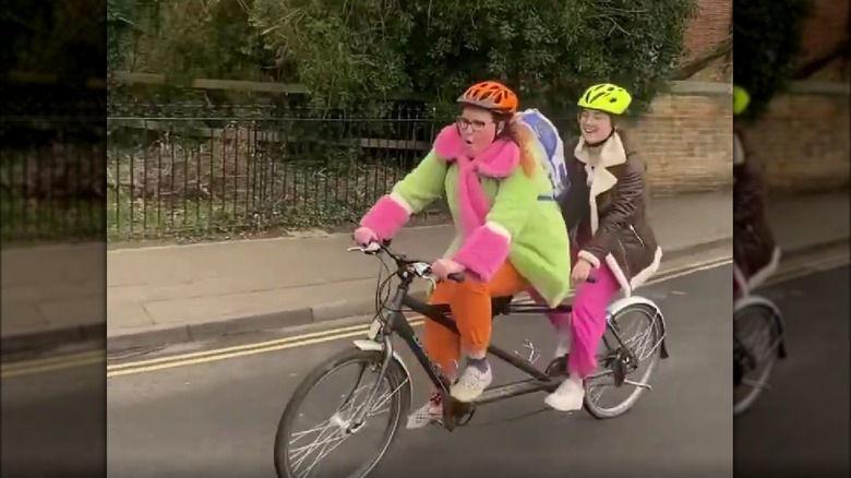 Aker and Cox on a tandem bike