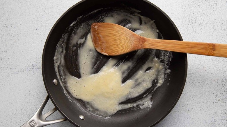 roux in frying pan with wooden spatula