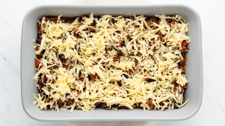 shredded cheese in baking dish