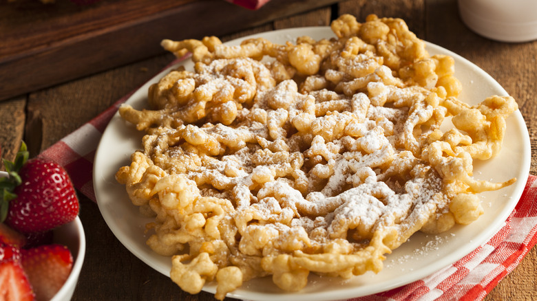 funnel cake on white plate 