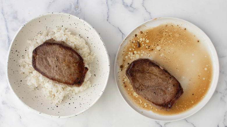 steak on bed of rice