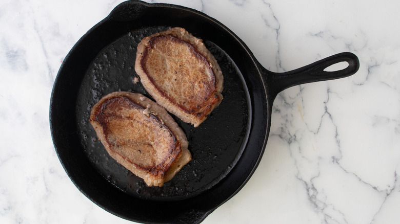 seared steaks in skillet