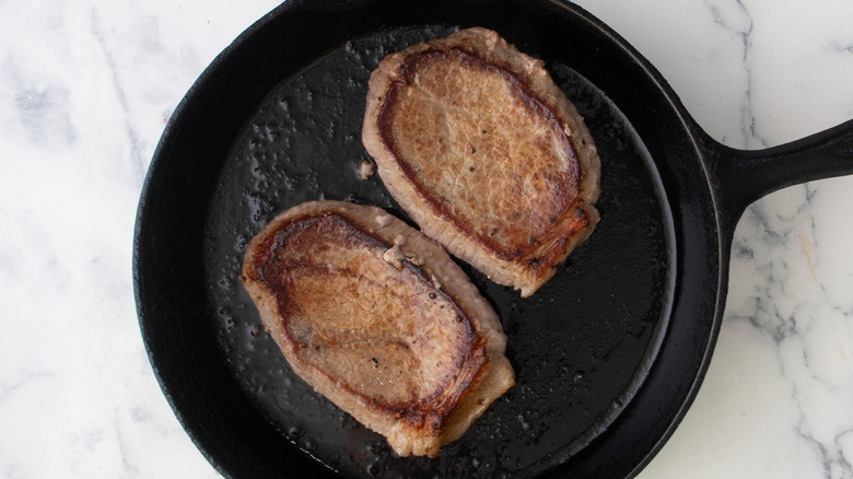 steaks in skillet