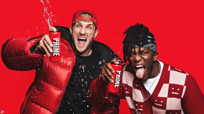 Logan Paul and KSI posing with Prime energy cans