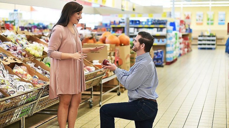 Couple getting engaged in Aldi