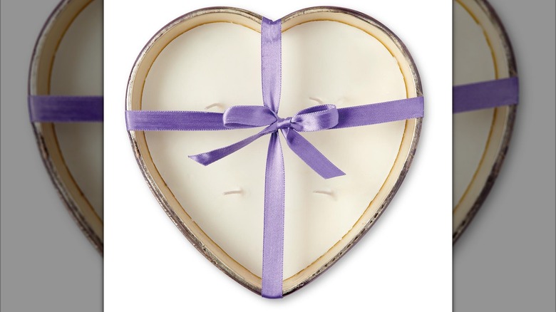 heart shaped candle purple ribbon