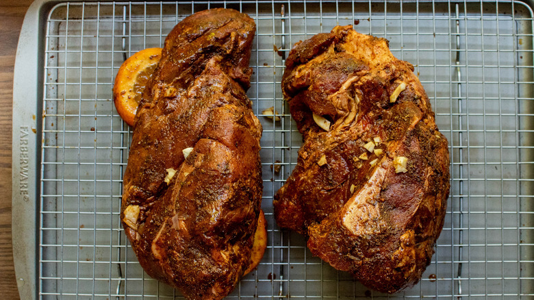 two pork butts on sheet tray 