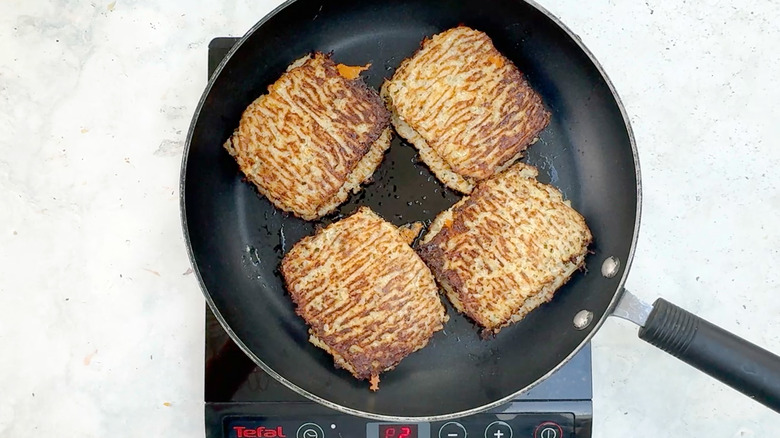 four cauliflower grilled cheese in frying pan