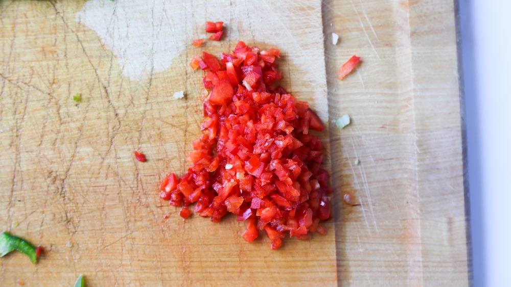 Minced vegetables on cutting board