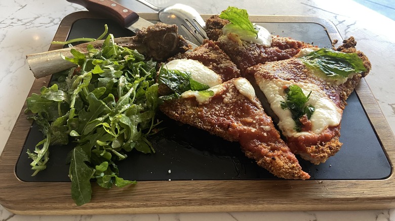 veal parmesan with salad